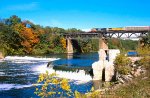 CN, Canadian National 2654 -UP 9507, leads a westbound autorack train across the Grand River at Penmans Park, Paris, Ontario. October 3, 2004. 